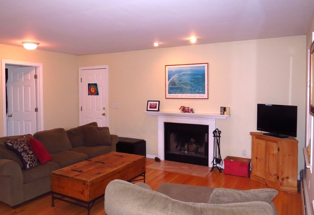 11 Smith Road Sutton, MA 01590 - Photo 3 of 11 a living room with furniture and a fireplace