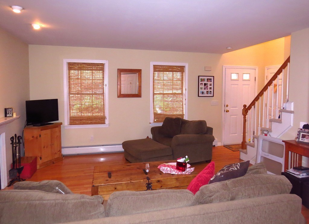 11 Smith Road Sutton, MA 01590 - Photo 4 of 11 a living room with furniture or wooden floor and a flat screen tv