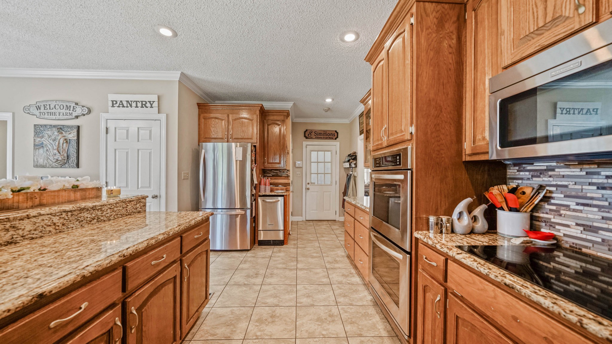 21 Partin Road Taft, TN 38488 - Photo 14 of 30 a kitchen with stainless steel appliances granite countertop a refrigerator and a stove