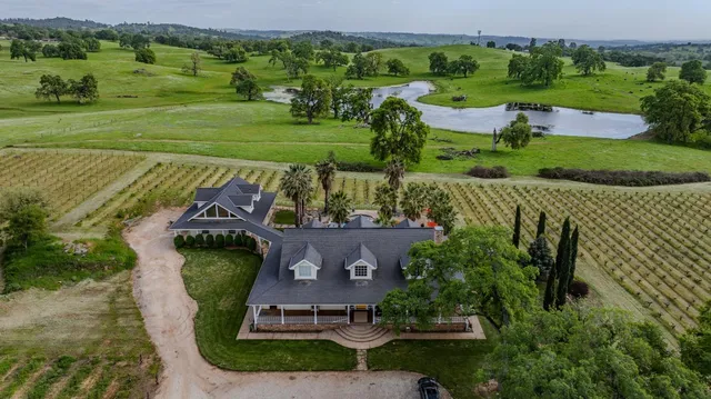 an aerial view of a house with outdoor space