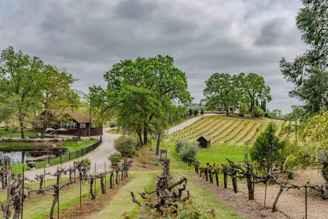 a kitchen with stainless steel appliances granite countertop a stove and cabinets
