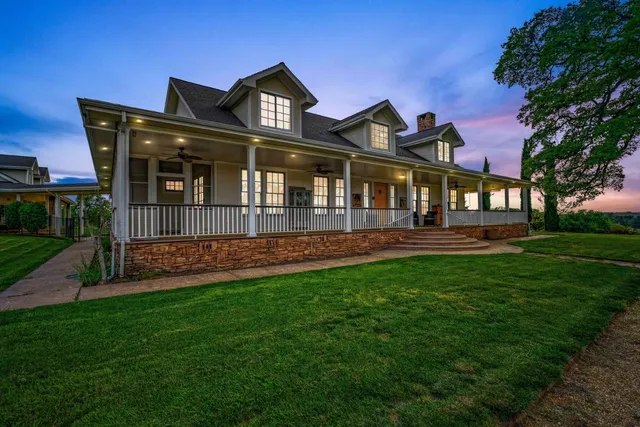 a spacious bedroom with a large bed and a large window