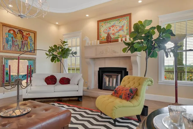 a kitchen with granite countertop white cabinets and stainless steel appliances