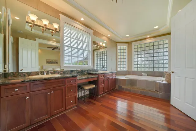 a front view of a house with swimming pool and sitting area