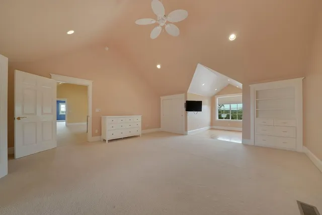 a view of a lake with a yard and outdoor seating