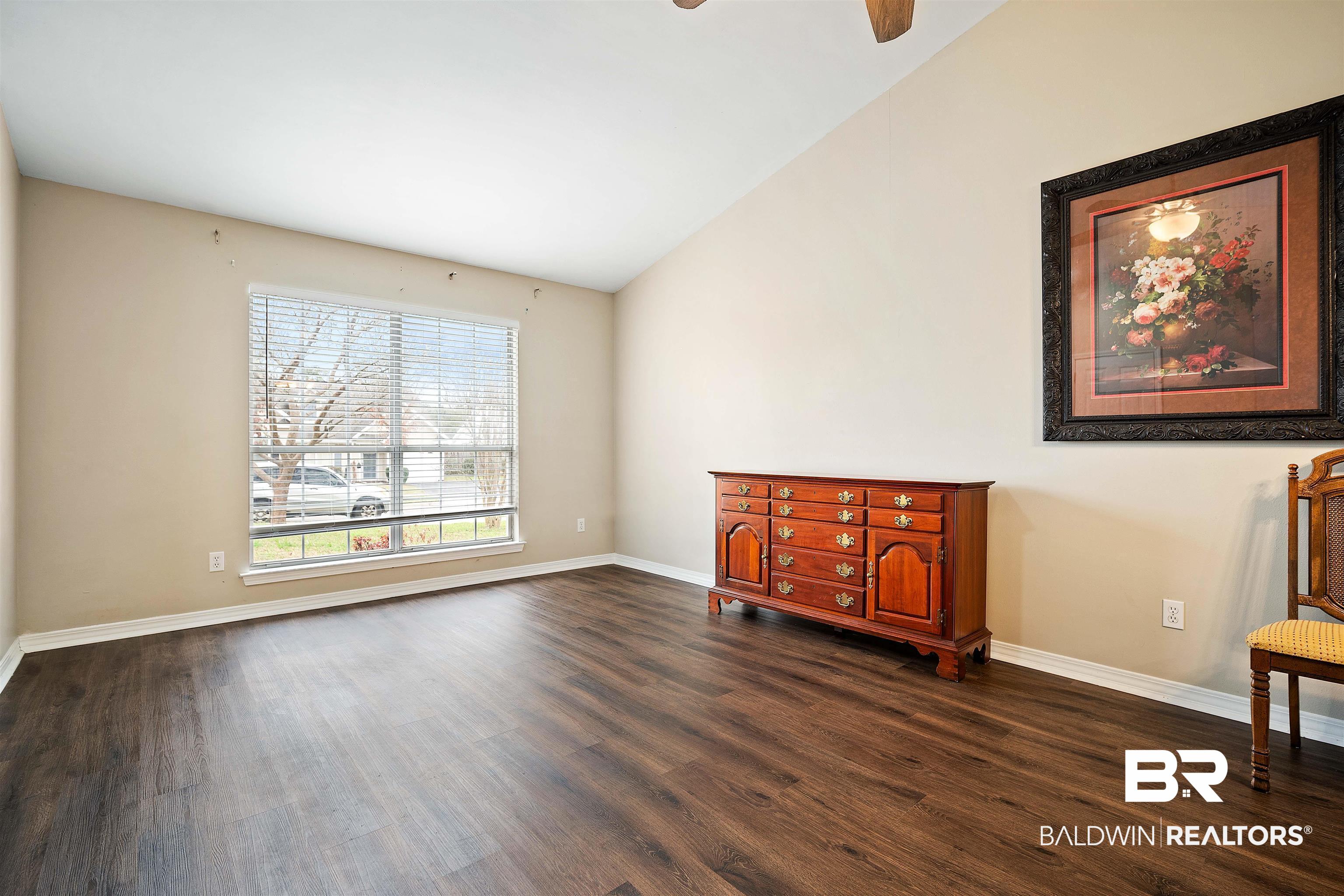 628 Spring Lake Court Mobile, AL 36695 - Photo 6 of 25 Interior space featuring dark wood-type flooring, vaulted ceiling, and ceiling fan