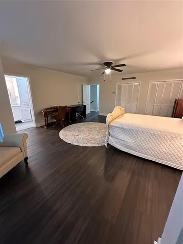 a white toilet sitting next to a bath tub