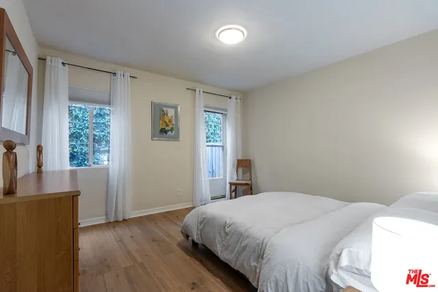a bathroom with a sink toilet a mirror and shower