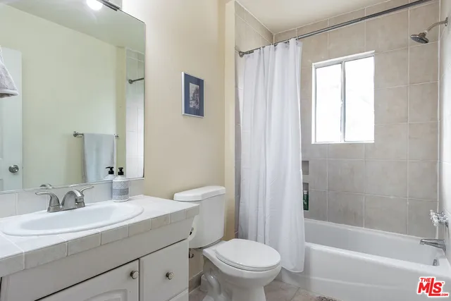 a room with a bed and a window