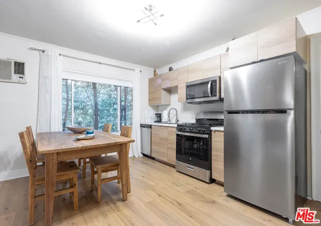 a kitchen with a table and chairs in it