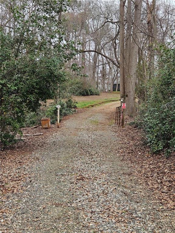 228 Storey Street Jefferson, GA 30549 - Photo 2 of 6 a view of a park with large trees