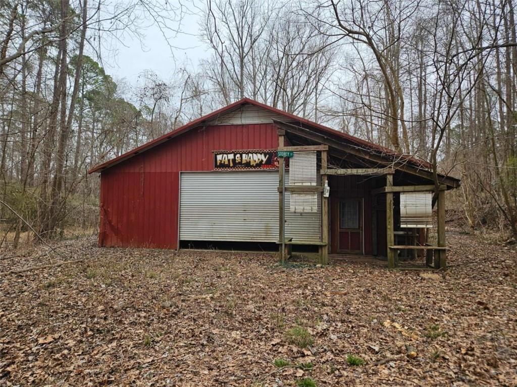 228 Storey Street Jefferson, GA 30549 - Photo 4 of 6 a front view of a house with a yard