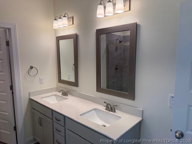 180 Rabbit Run Drive Smithfield, NC 27577 - Photo 15 of 19 a bathroom with 2 sink and a mirror