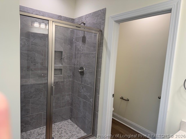 180 Rabbit Run Drive Smithfield, NC 27577 - Photo 16 of 19 a bathroom with a glass shower door