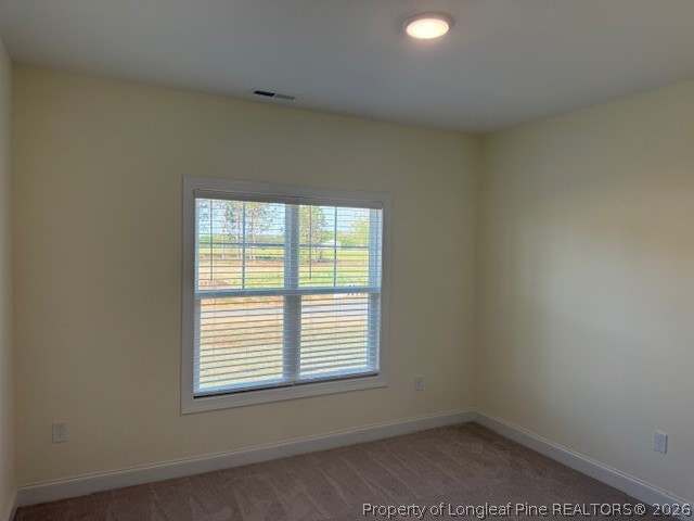 180 Rabbit Run Drive Smithfield, NC 27577 - Photo 9 of 19 an empty room with a window