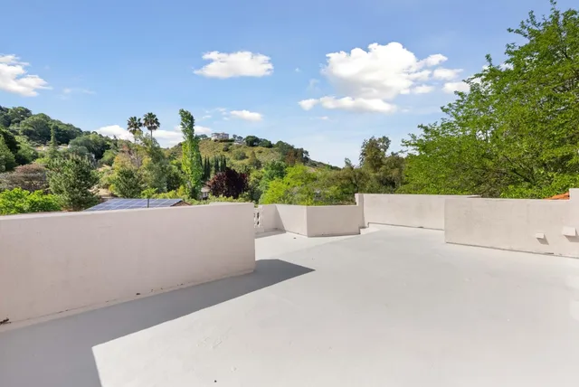 a kitchen with stainless steel appliances kitchen island granite countertop a sink and cabinets