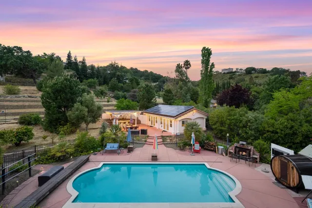 a view of a swimming pool with a patio