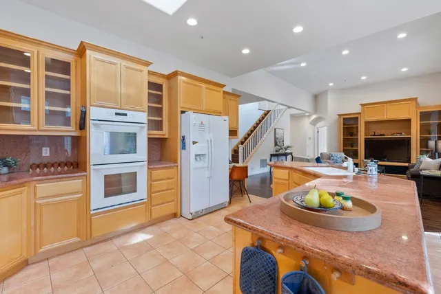 a view of empty room with wooden floor and closet
