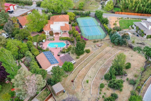 an aerial view of residential houses with outdoor space