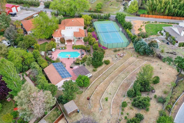 an aerial view of residential houses with outdoor space