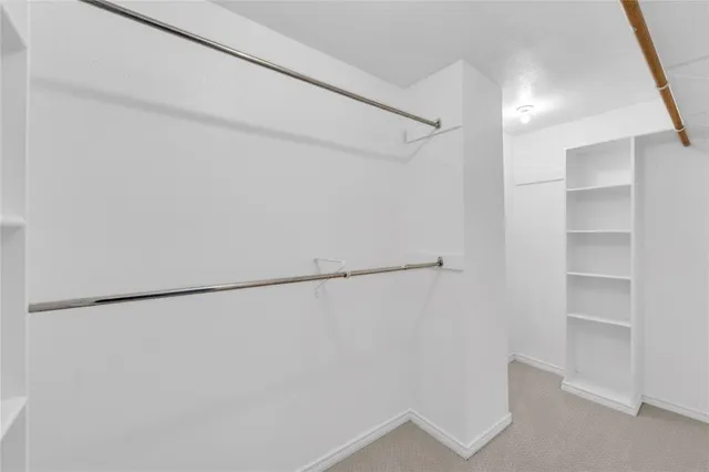 a view of a room with a large window