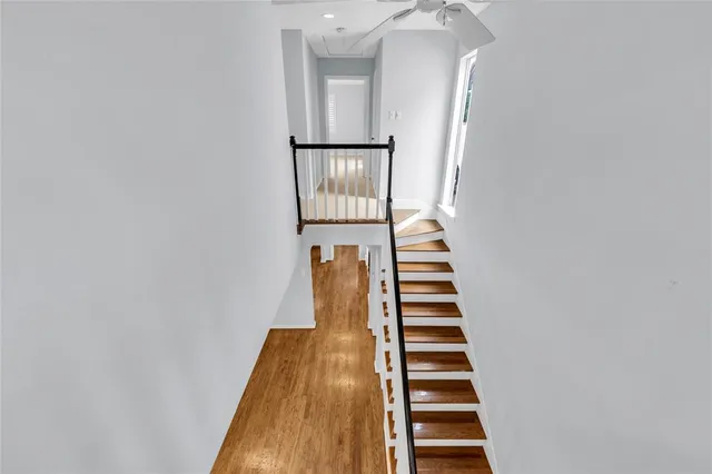 a view of balcony with wooden floor and fence