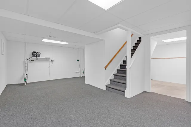 a view of an empty room with stairs