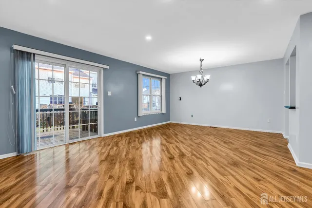 a dining room with a table and chairs
