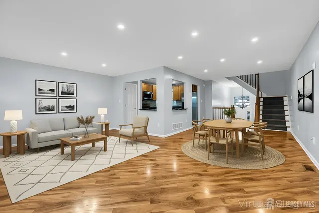 a living room with fireplace furniture and a flat screen tv