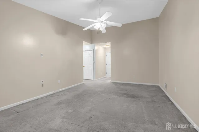 a room with a bed and a chandelier