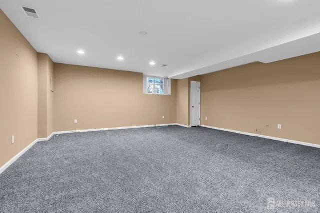 a view of a livingroom with furniture and wooden floor