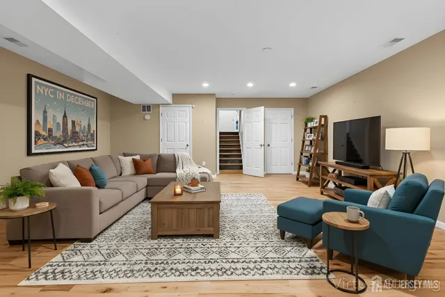 a view of empty room with wooden floor and fireplace