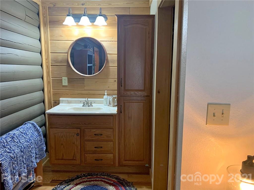 279 Observation Ridge Rutherfordton, NC 28139 - Photo 22 of 32 a bathroom with a sink and a mirror