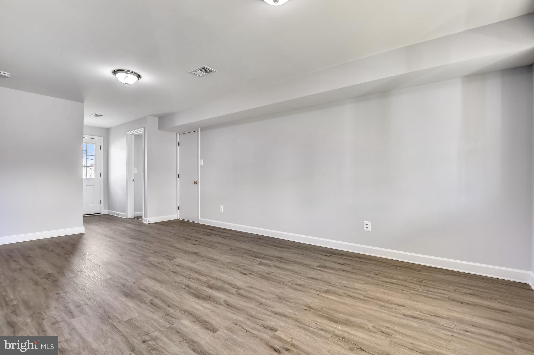 1515 Chivalry Court Rosedale, MD 21237 - Photo 11 of 36 Family Room with New Flooring