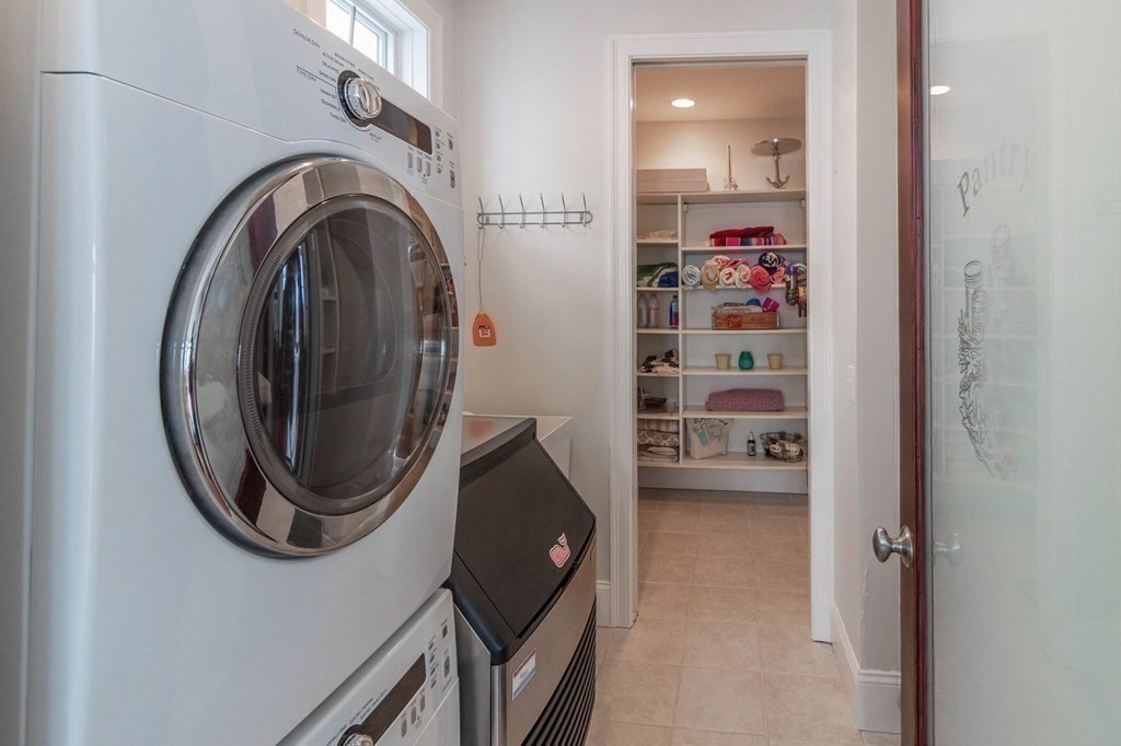 73 K Street Hull, MA 02045 - Photo 17 of 42 a view of a storage and utility room with washer and dryer