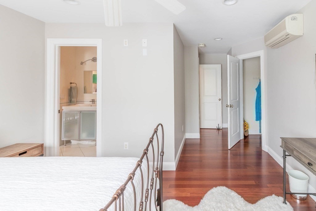 73 K Street Hull, MA 02045 - Photo 26 of 42 a view of a hallway with wooden floor and dining room