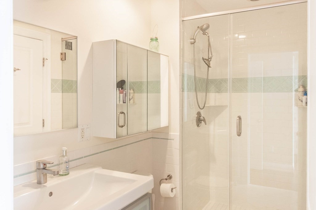 73 K Street Hull, MA 02045 - Photo 27 of 42 a bathroom with a shower and a sink