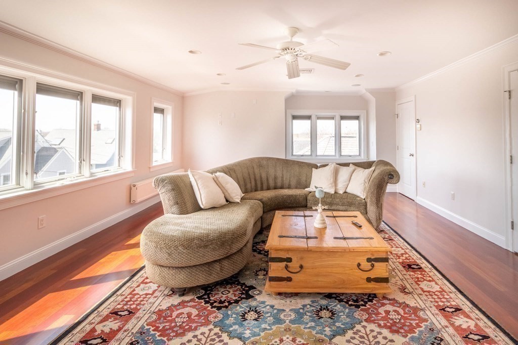 73 K Street Hull, MA 02045 - Photo 33 of 42 a living room with furniture and a rug