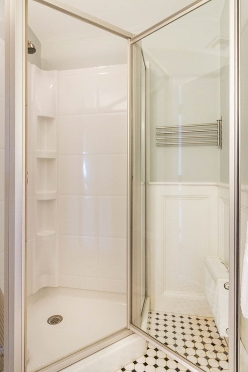 73 K Street Hull, MA 02045 - Photo 36 of 42 a bathroom with a glass shower door