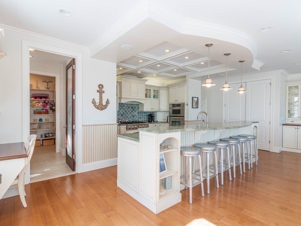 73 K Street Hull, MA 02045 - Photo 8 of 42 a view of kitchen with stainless steel appliances granite countertop counter space and cabinets