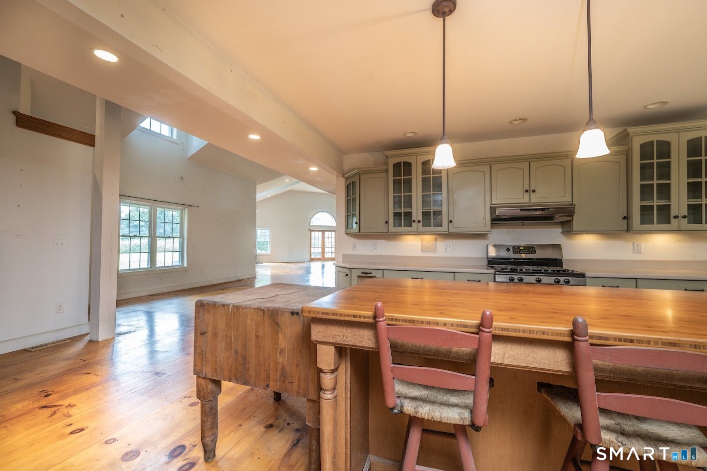 19 High Street Middlefield, CT 06455 - Photo 9 of 18 The custom country kitchen features an oversized gathering island and opens seamlessly to the soaring great room, creating an ideal space for entertaining and everyday living.