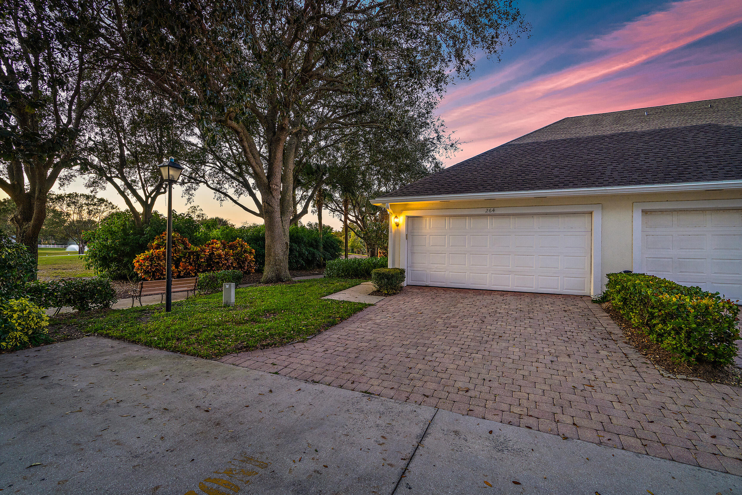 264 Murray Court Jupiter, FL 33458 - Photo 3 of 37 Garage & Back Exterior