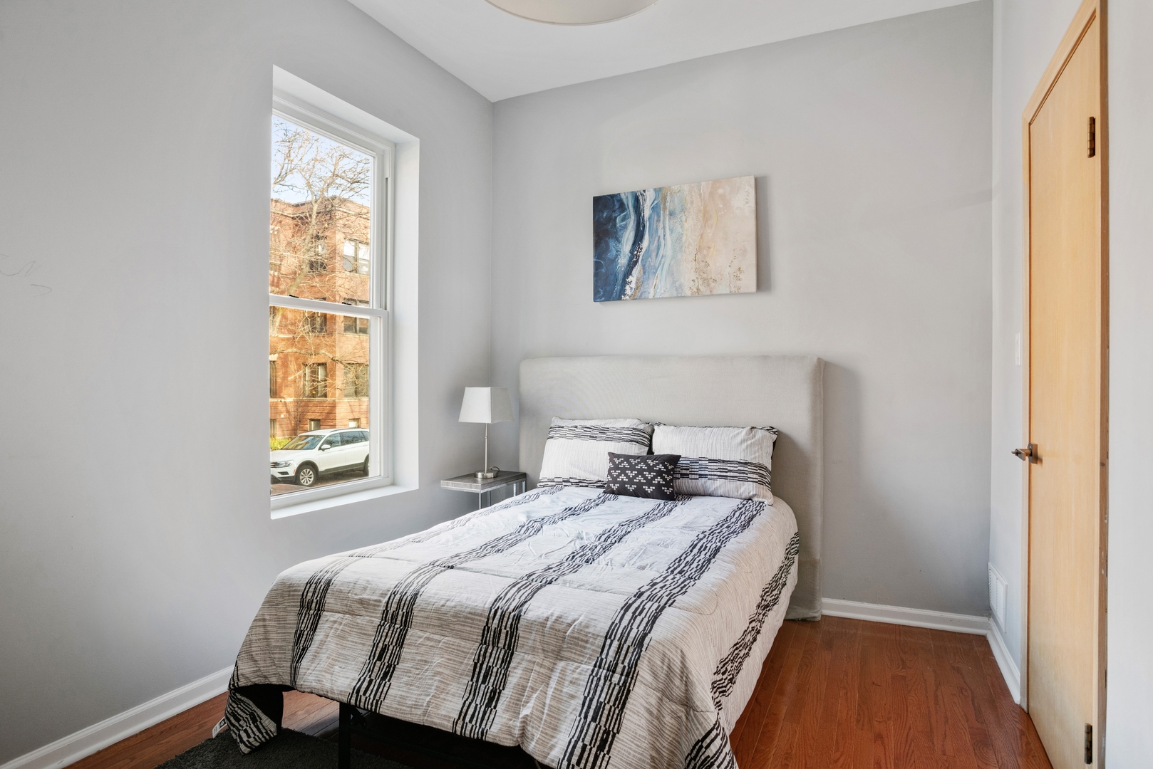 5556 North Wayne Avenue Chicago, IL 60640 - Photo 15 of 37 a bedroom with a bed and a window