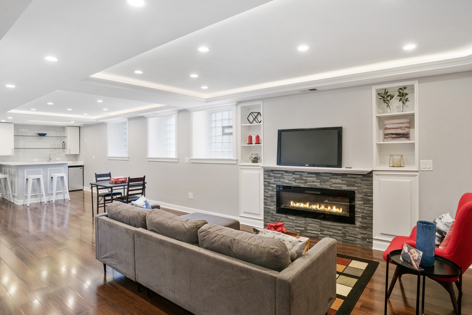 5556 North Wayne Avenue Chicago, IL 60640 - Photo 17 of 37 a living room with furniture and a fireplace