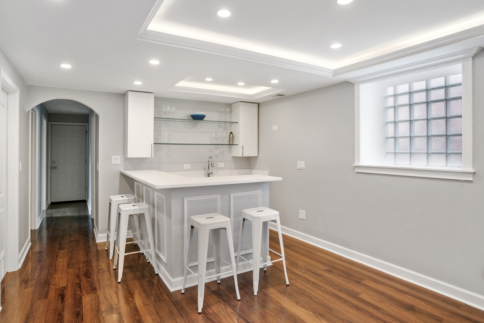 5556 North Wayne Avenue Chicago, IL 60640 - Photo 19 of 37 a kitchen with a sink cabinets and wooden floor
