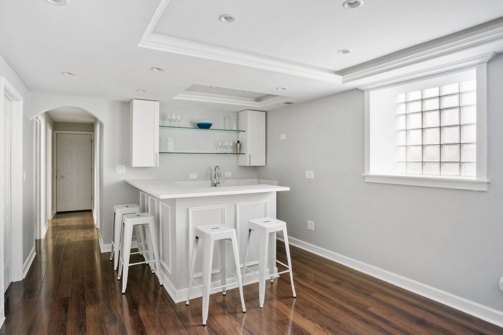 5556 North Wayne Avenue Chicago, IL 60640 - Photo 21 of 37 a kitchen with a sink cabinets and wooden floor