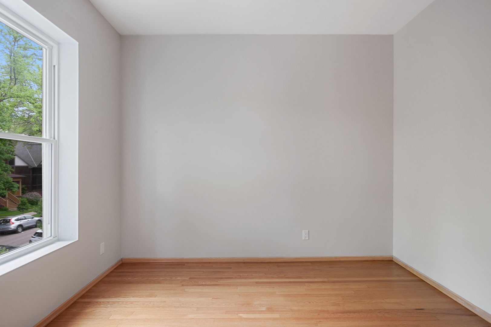 5556 North Wayne Avenue Chicago, IL 60640 - Photo 37 of 37 a view of an empty room with wooden floor and a window