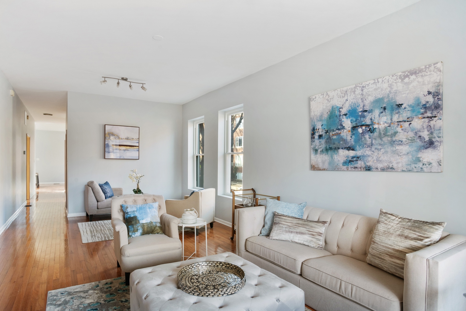 5556 North Wayne Avenue Chicago, IL 60640 - Photo 7 of 37 a living room with furniture and wooden floor