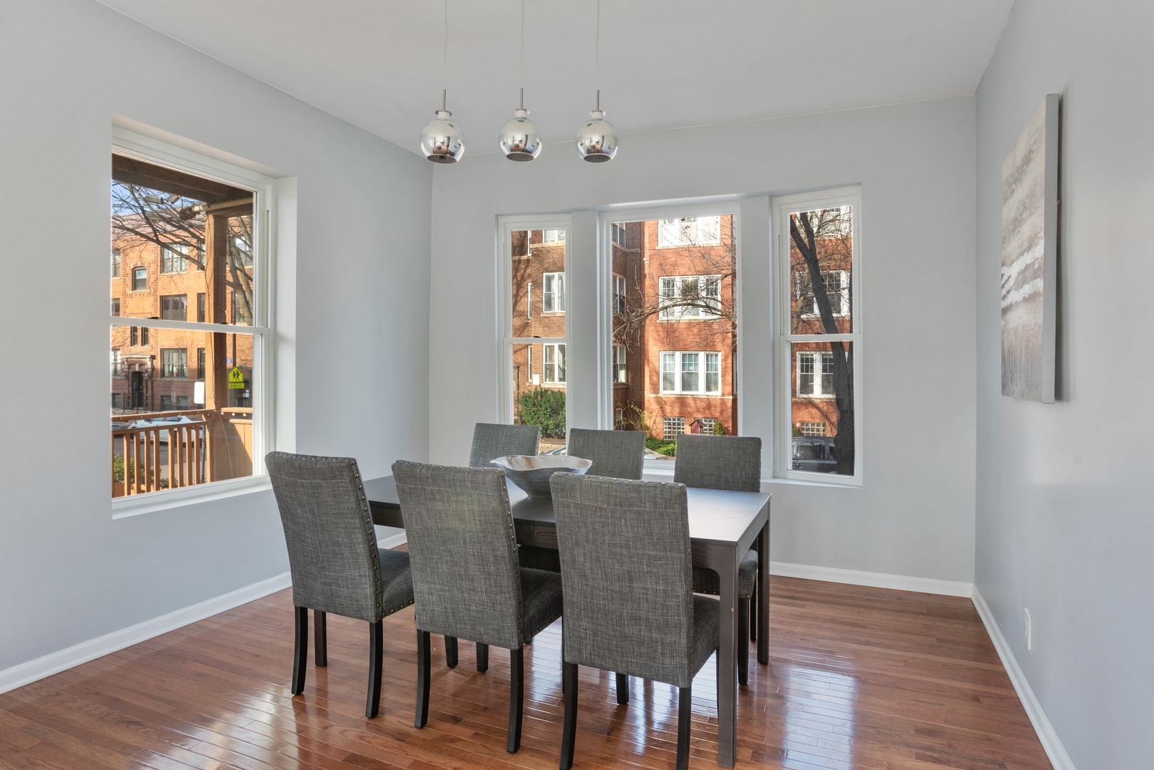 5556 North Wayne Avenue Chicago, IL 60640 - Photo 10 of 37 a view of a dining room with furniture and windows