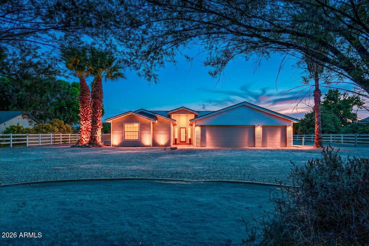7624 North Citrus Road Waddell, AZ 85355 - Photo 2 of 57 a front view of a house with garden
